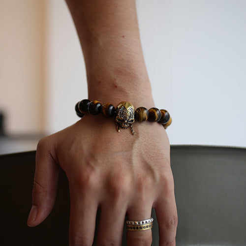 Pirates of the Caribbean: Dead Men Tell No Tales Skull Bracelet in Tiger Eye - Gold